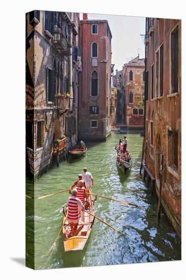 Local Gondaliers Row their Traditional Boat in One of Cannaregios Canals, Cannaregio, Venice-Cahir Davitt-Stretched Canvas