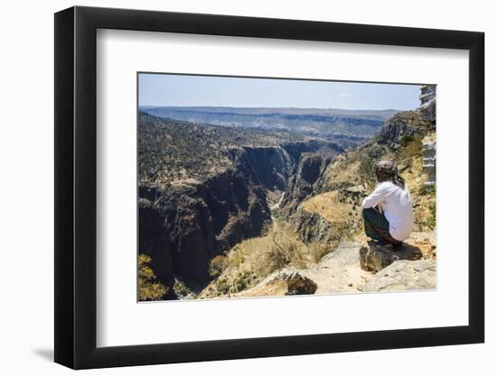 Local Man Looking at a Huge Canyon on the Dixsam Plateau on the Island of Socotra-Michael Runkel-Framed Photographic Print