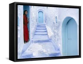 Local Woman Steps Out into Whitewashed Streets of Rif Mountains Town of Chefchaouen, Morocco-Andrew Watson-Framed Stretched Canvas