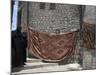 Local Woman Walking Down Steps, Blanket on Wall, Aleppo (Haleb), Syria, Middle East-Christian Kober-Mounted Photographic Print