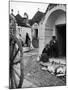 Locals Outside Trulli Homes Made from Limestone Boulders and Feature Conical or Domed Roofs-Alfred Eisenstaedt-Mounted Photographic Print