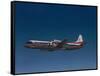 Lockheed L-188 Electra Airplane in Flight-null-Framed Stretched Canvas