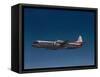 Lockheed L-188 Electra Airplane in Flight-null-Framed Stretched Canvas
