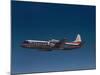 Lockheed L-188 Electra Airplane in Flight-null-Mounted Photographic Print