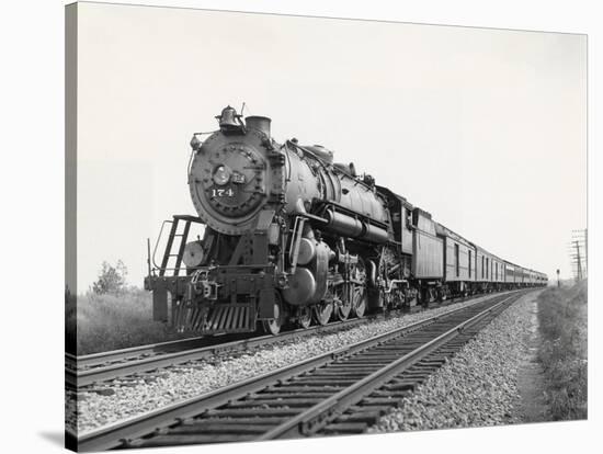 Locomotive Train Moving down Tracks-null-Stretched Canvas