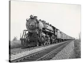 Locomotive Train Moving down Tracks-null-Stretched Canvas