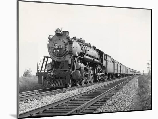 Locomotive Train Moving down Tracks-null-Mounted Photographic Print