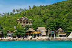 A traditional Thai resort overlooks turquoise water on the tropical island of Koh Tao, Thailand-Logan Brown-Photographic Print