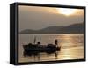 Lone Fisherman Casts His Net at Twilight off the Adriatic Coast-null-Framed Stretched Canvas