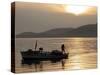 Lone Fisherman Casts His Net at Twilight off the Adriatic Coast-null-Stretched Canvas