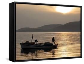 Lone Fisherman Casts His Net at Twilight off the Adriatic Coast-null-Framed Stretched Canvas