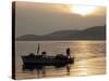 Lone Fisherman Casts His Net at Twilight off the Adriatic Coast-null-Stretched Canvas