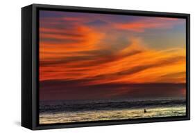 Lone Surfer and Sunset Clouds Off Playa Hermosa Surf Beach, Santa Teresa, Costa Rica-Rob Francis-Framed Stretched Canvas