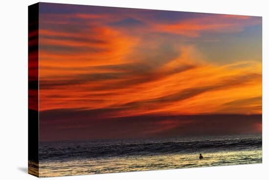 Lone Surfer and Sunset Clouds Off Playa Hermosa Surf Beach, Santa Teresa, Costa Rica-Rob Francis-Stretched Canvas