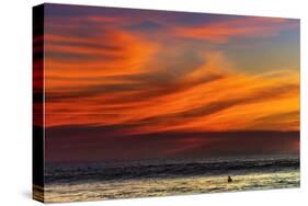 Lone Surfer and Sunset Clouds Off Playa Hermosa Surf Beach, Santa Teresa, Costa Rica-Rob Francis-Stretched Canvas