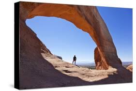 Lone Tourist Hiker at Wilson Arch, Near Moab, Utah, United States of America, North America-Neale Clark-Stretched Canvas