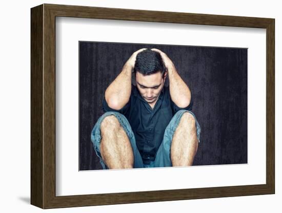 Lonely and Sad Young Man Sitting on the Floor with His Head between His Hands-Kamira-Framed Photographic Print