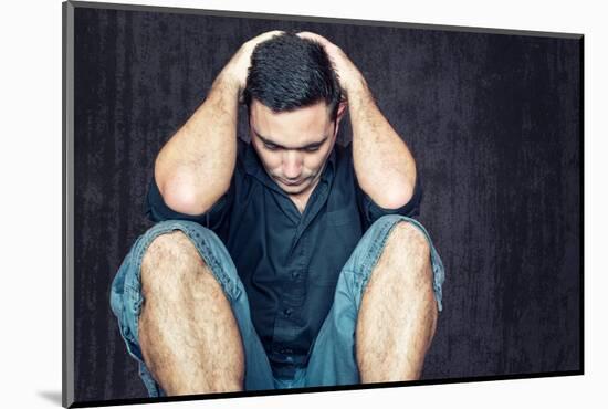 Lonely and Sad Young Man Sitting on the Floor with His Head between His Hands-Kamira-Mounted Photographic Print