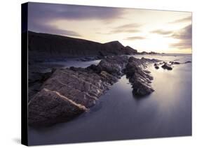 Long Exposure of Waves Moving over Rocks on Crackington Haven Beach at Sunset, Cornwall, England-Ian Egner-Stretched Canvas