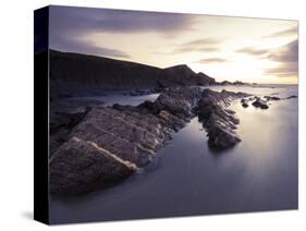 Long Exposure of Waves Moving over Rocks on Crackington Haven Beach at Sunset, Cornwall, England-Ian Egner-Stretched Canvas