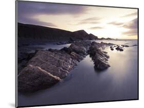 Long Exposure of Waves Moving over Rocks on Crackington Haven Beach at Sunset, Cornwall, England-Ian Egner-Mounted Photographic Print