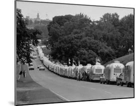 Long Line of Airstream Trailers Wait for Parking Space at a Campground During a Trailer Rally-Ralph Crane-Mounted Photographic Print
