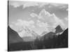 Looking Across Forest To Mountains And Clouds "In Glacier National Park" Montana. 1933-1942-Ansel Adams-Stretched Canvas