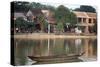 Looking across the Thu Bon River to the ancient town of Hoi An, Vietnam-Paul Dymond-Stretched Canvas