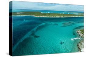 Looking Down at Airplane's Shadow, Jet Ski, Clear Tropical Water and Islands, Exuma Chain, Bahamas-James White-Stretched Canvas