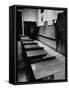 Looking Down Row of Empty Scarred Old Fashioned Desks in Schoolroom-Walter Sanders-Framed Stretched Canvas