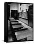 Looking Down Row of Empty Scarred Old Fashioned Desks in Schoolroom-Walter Sanders-Framed Stretched Canvas