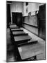 Looking Down Row of Empty Scarred Old Fashioned Desks in Schoolroom-Walter Sanders-Mounted Photographic Print