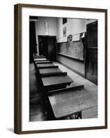 Looking Down Row of Empty Scarred Old Fashioned Desks in Schoolroom-Walter Sanders-Framed Photographic Print