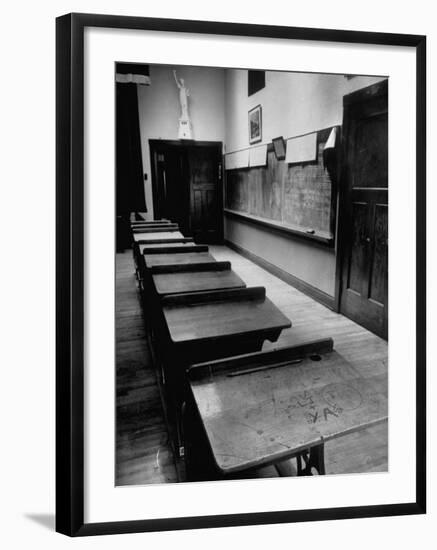 Looking Down Row of Empty Scarred Old Fashioned Desks in Schoolroom-Walter Sanders-Framed Photographic Print