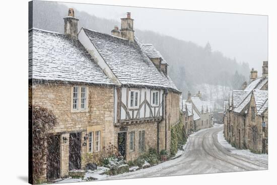 Looking down the quintessential English village of Castle Combe in the snow, Wiltshire, England, Un-Paul Porter-Stretched Canvas