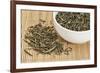 Loose Leaf Sencha Green Tea in a White China Cup and Spilled over Bamboo Mat-PixelsAway-Framed Photographic Print