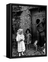 Lorenza Curiel in White First Communion Dress Waiting for Mother to Lock Door-W^ Eugene Smith-Framed Stretched Canvas