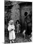 Lorenza Curiel in White First Communion Dress Waiting for Mother to Lock Door-W^ Eugene Smith-Mounted Photographic Print