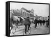 Los Angeles Police Officers Bicycling Past Broadway Storefronts-null-Framed Stretched Canvas