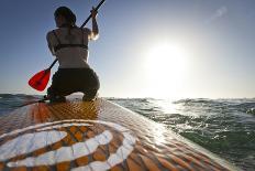 Woman on Stand Up Paddle-Board Heads into the Sunset at San Onofre Beach, San Clemente, California-Louis Arevalo-Photographic Print