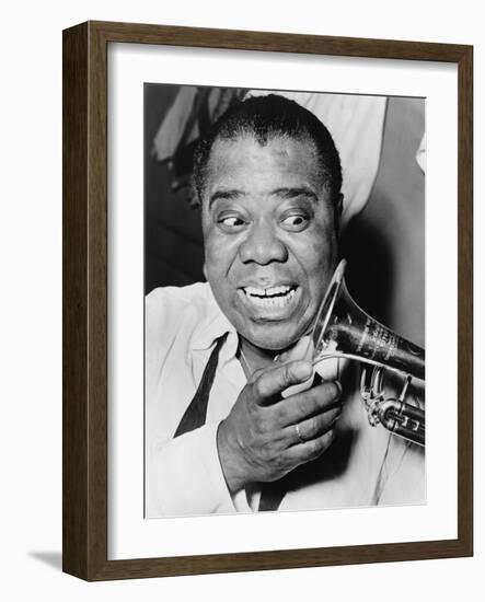 Louis Armstrong, African American Jazz Musician, with His Trademark Smile and Trumpet, 1953-null-Framed Photo