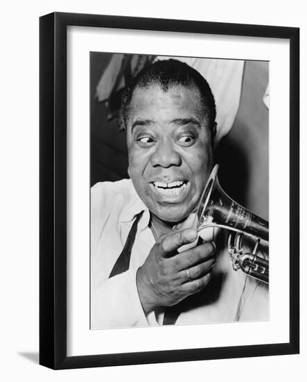 Louis Armstrong, African American Jazz Musician, with His Trademark Smile and Trumpet, 1953-null-Framed Photo