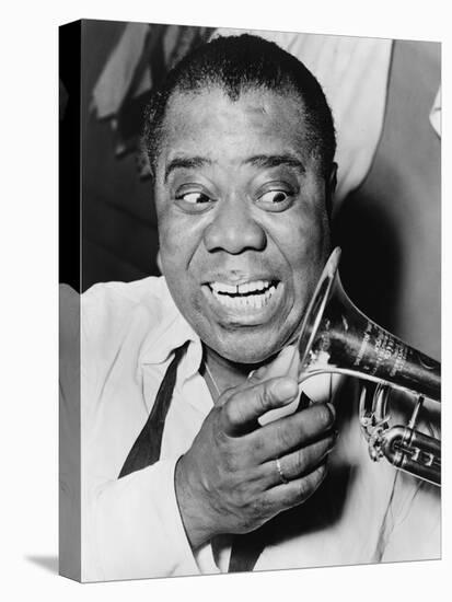 Louis Armstrong, African American Jazz Musician, with His Trademark Smile and Trumpet, 1953-null-Stretched Canvas