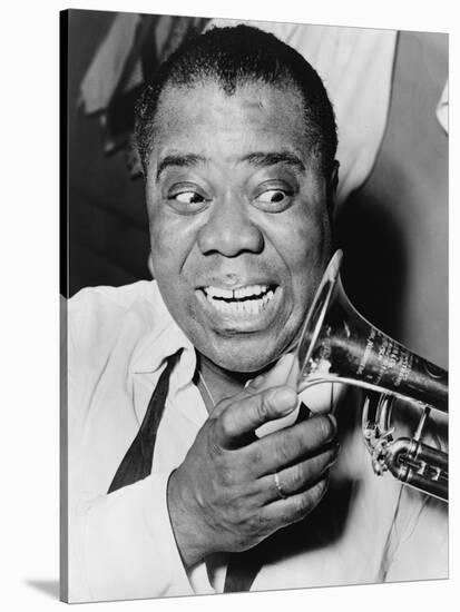 Louis Armstrong, African American Jazz Musician, with His Trademark Smile and Trumpet, 1953-null-Stretched Canvas