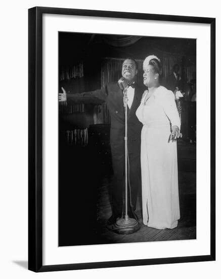 Louis Armstrong and Vocalist Performing in Floor Show at Cafe Zanzibar-Alfred Eisenstaedt-Framed Premium Photographic Print