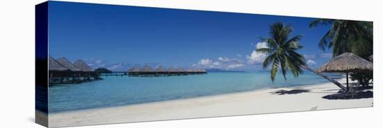 Lounge Chair under a Beach Umbrella, Moana Beach, Bora Bora, French Polynesia-null-Stretched Canvas