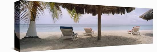 Lounge Chairs on 7-Mile Beach, Negril, Jamaica-null-Stretched Canvas