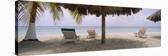 Lounge Chairs on 7-Mile Beach, Negril, Jamaica-null-Stretched Canvas