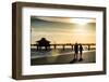 Loving Couple walking along the Beach at Sunset-Philippe Hugonnard-Framed Photographic Print