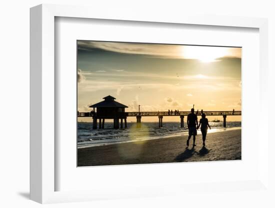 Loving Couple walking along the Beach at Sunset-Philippe Hugonnard-Framed Photographic Print